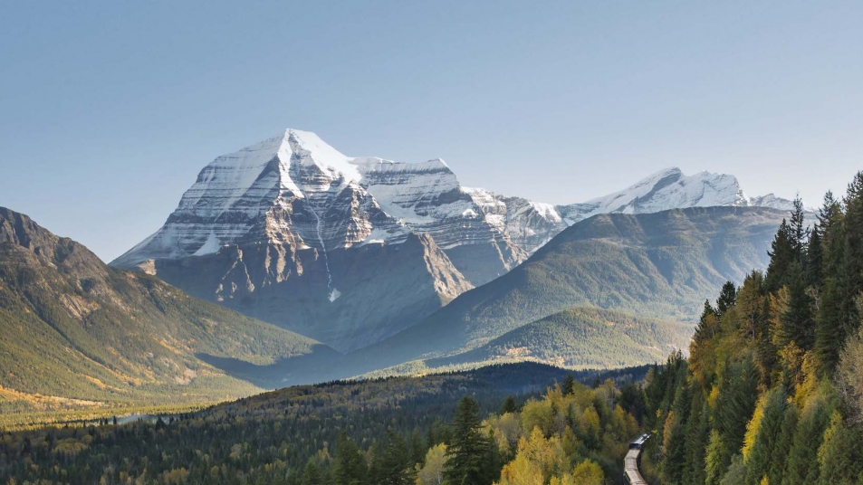 Rocky Mountaineer with Mount Robson, the tallest peak in the Canadian Rockies, in the background.