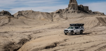 Colorado Overlander Vehicle in front of sandy landscape