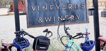 Spanish Valley Vineyards & Winery sign with e-bikes in front