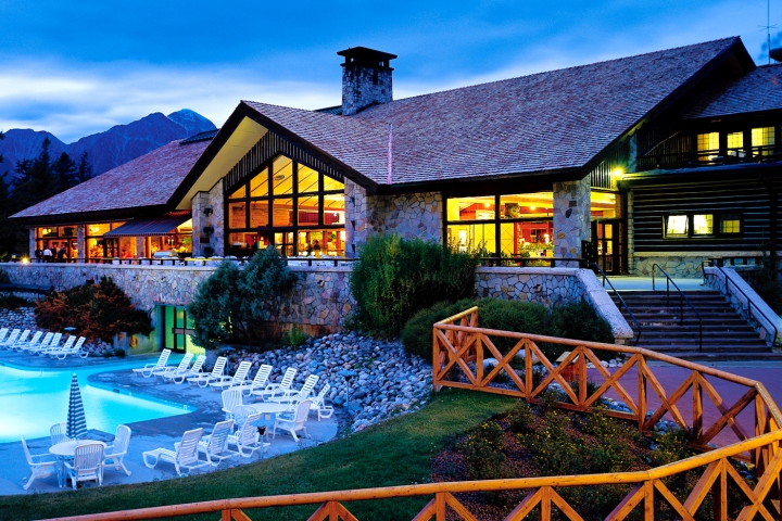 fairmont jasper park lodge pool at desk, mountains in the background