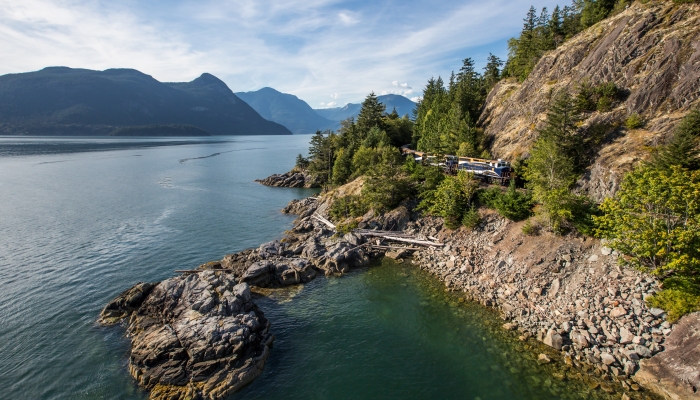 rocky mountaineer train travelling through the howe sound on the way to Whistler from Vancouver