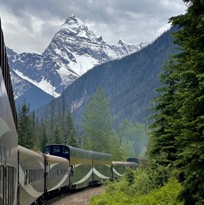 Rocky Mountaineer train traveling under mountain in the Canadian Rockies